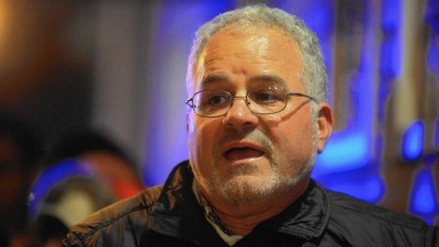 Fr. Bruce Wellems leading a December 2015 Posada procession at his parish ... when he's not supposed to be acting as a priest - (Photo credit Chicago Tribune)